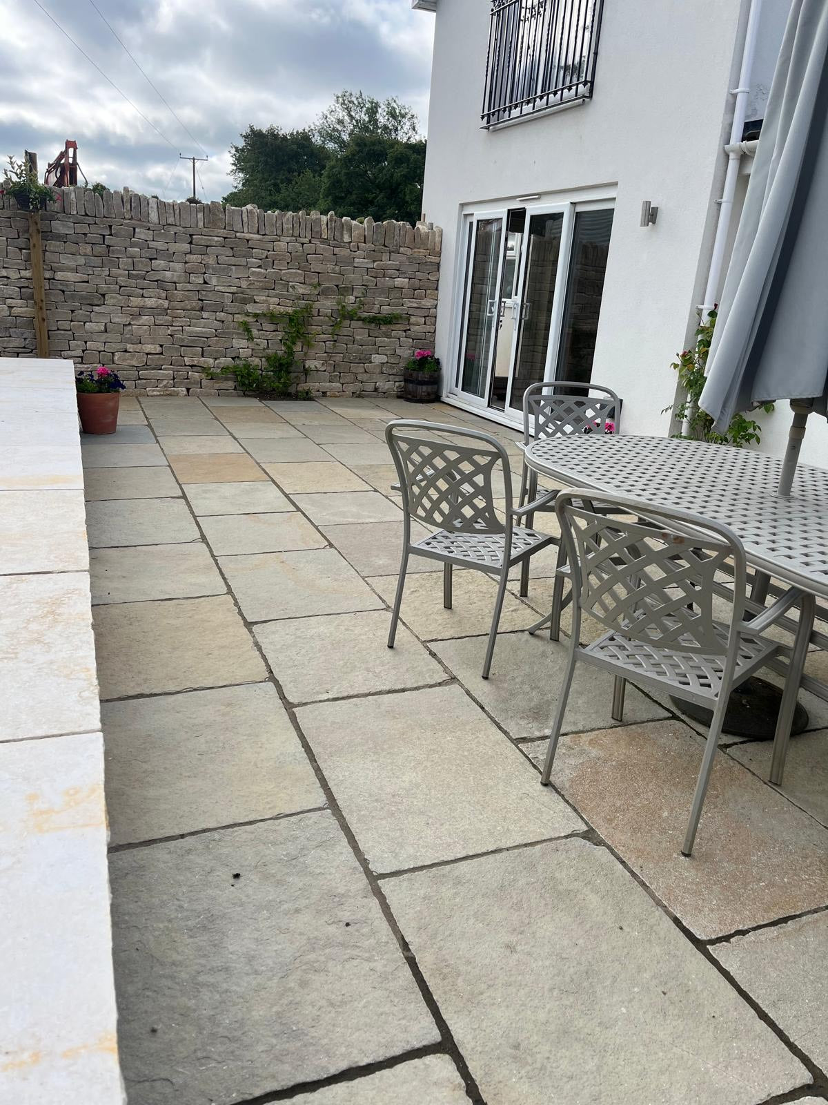 Garden renovation, slabs, drystone wall and garden furniture. 