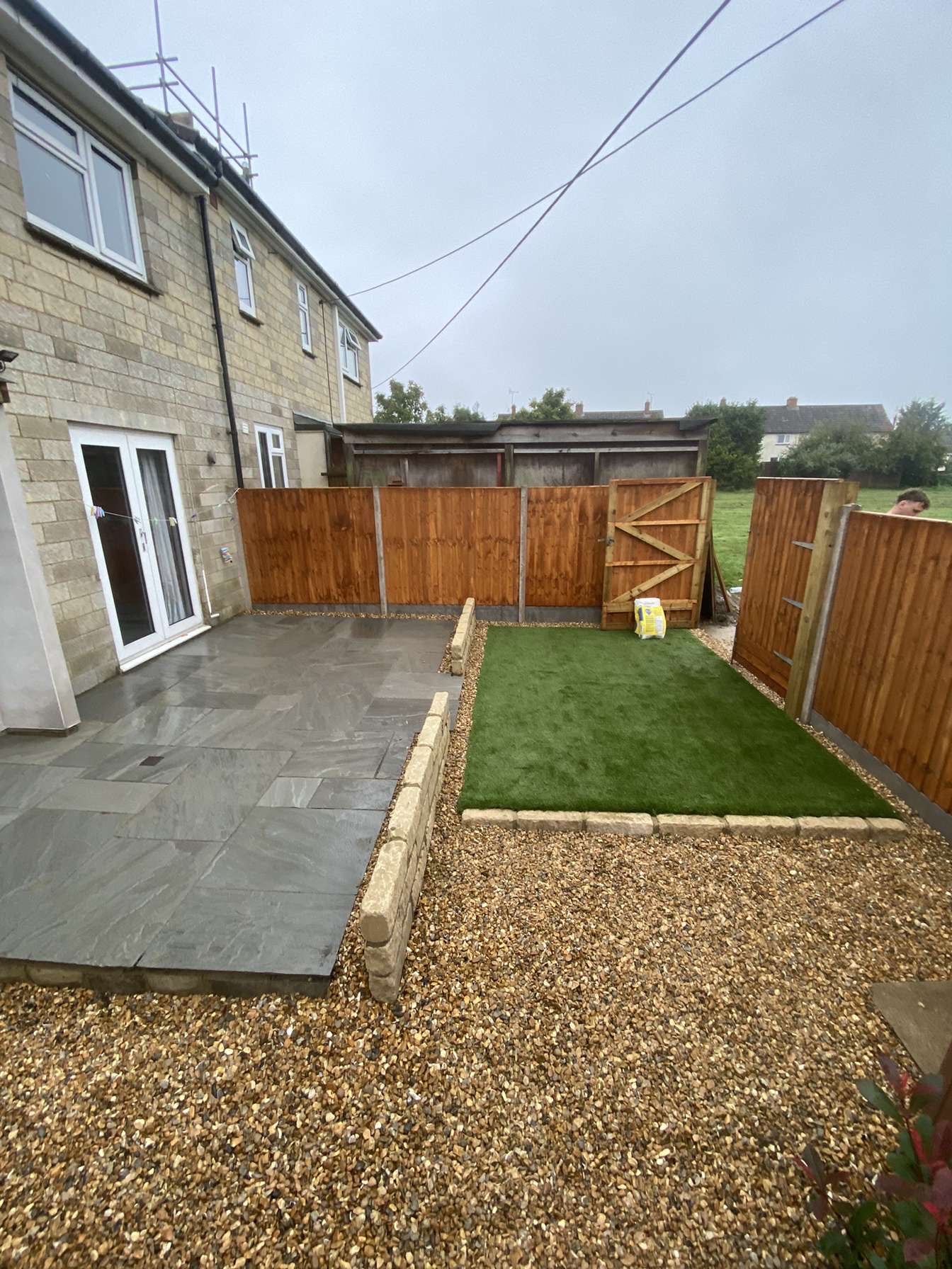 picture of garden renovation which included artificial turf and new fencing.