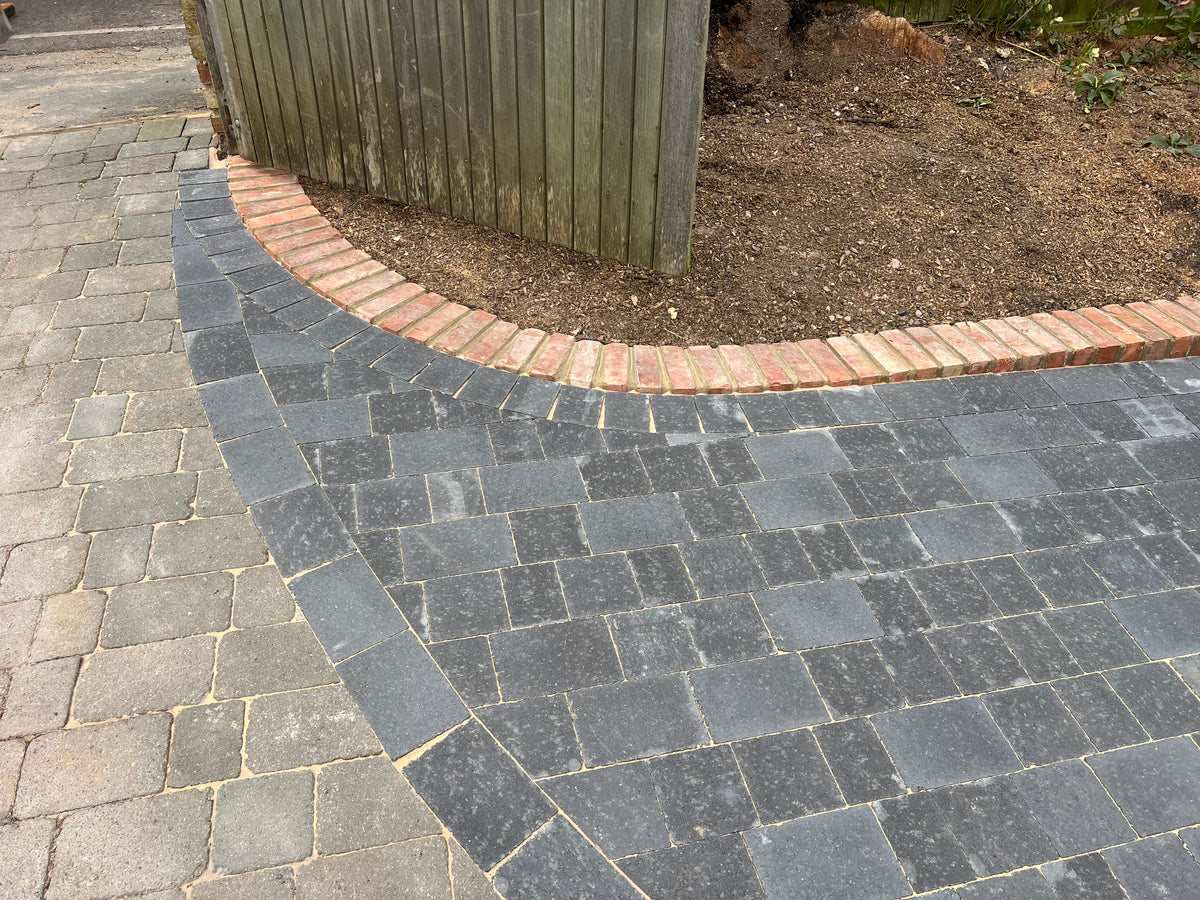 Block paving driveway with redbrick wall in Henley-On-Thames. 