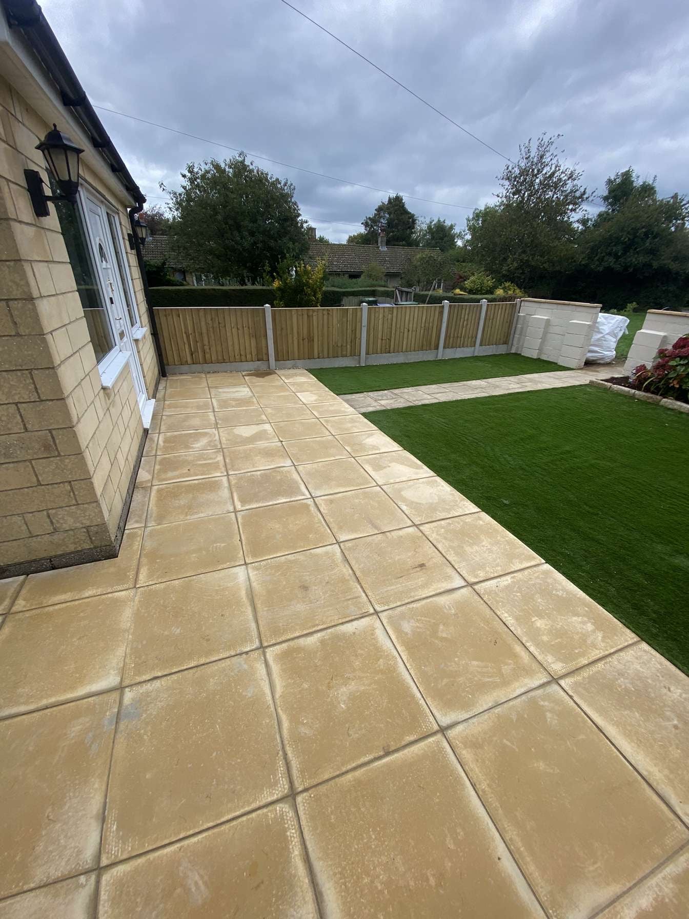 View of 600x600 concrete slabs laid in garden renovation for client in Shiplake. 