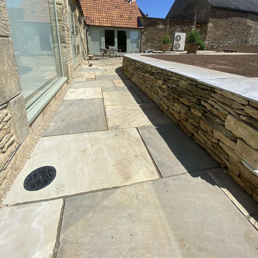 Patio and drystone wall built on farmhouse in Oxfordshire