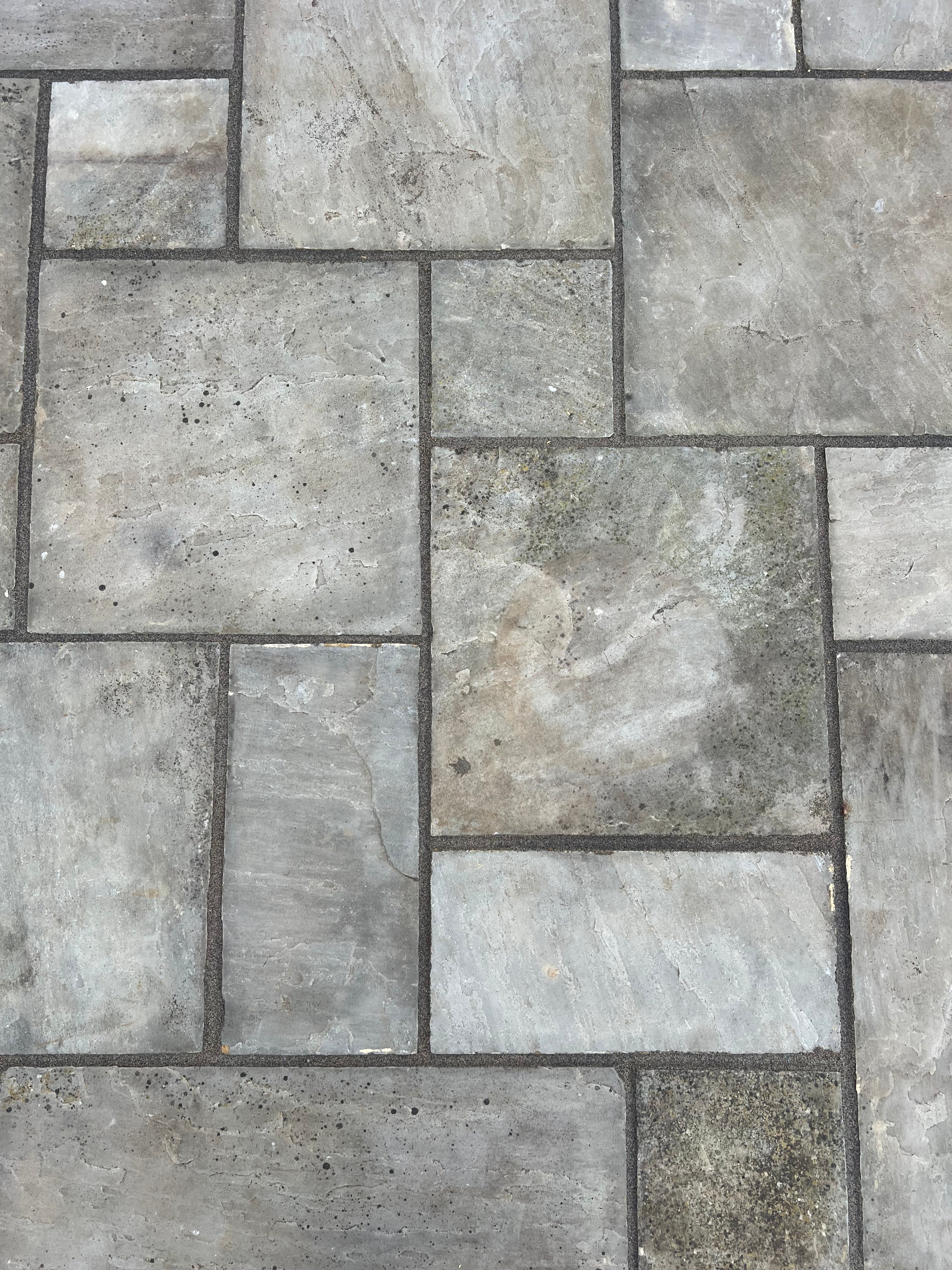 Close up of grey sandstone tiles in Stoke Row Oxfordshire